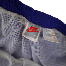 Load image into Gallery viewer, Vintage 90s Nike Big Spellout Swim Trunks. Features 90s gray tag - L