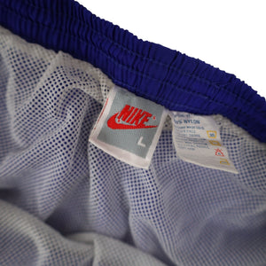 Vintage 90s Nike Big Spellout Swim Trunks. Features 90s gray tag - L