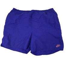 Load image into Gallery viewer, Vintage 90s Nike Big Spellout Swim Trunks. Features 90s gray tag - L