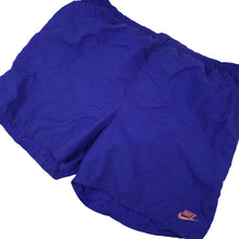 Load image into Gallery viewer, Vintage 90s Nike Big Spellout Swim Trunks. Features 90s gray tag - L